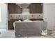 Unfinished kitchen with modern cabinets and a central island wrapped in plastic at 39 Atherton Circle, Angier, NC 27501