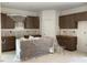 Unfinished kitchen with modern cabinets and a central island wrapped in plastic at 39 Atherton Circle, Angier, NC 27501