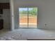 Open living area with sliding glass doors that open to the outdoor deck at 39 Atherton Circle, Angier, NC 27501