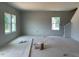 Spacious living room with bright windows, awaiting your personal touch at 39 Atherton Circle, Angier, NC 27501