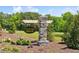Community signage for Cambridge Reserve amid lush landscaping, flowers, and green foliage at 39 Atherton Circle, Angier, NC 27501