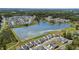 Breathtaking aerial view of community featuring a pond near homes with well-kept lawns and landscaping at 4102 Catfish Way, Durham, NC 27703
