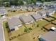 Aerial shot features homes backing onto lush greenery with a mix of fences and natural barriers in a Gathering-friendly neighborhood at 4102 Catfish Way, Durham, NC 27703