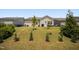 Expansive backyard featuring lush green grass and young trees providing a serene and private outdoor space for relaxation at 4102 Catfish Way, Durham, NC 27703