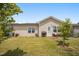 A cozy outdoor seating area and lush landscaping complete the backyard at 4102 Catfish Way, Durham, NC 27703