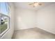 Bright, unfurnished bedroom with neutral carpet flooring and a large window with a view at 4102 Catfish Way, Durham, NC 27703
