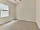 Neutral bedroom showcasing natural light, beige carpet, and a blank canvas for personalization at 4102 Catfish Way, Durham, NC 27703