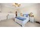 Bright bedroom with a ceiling fan, neutral walls, and carpet flooring, creating a cozy and inviting atmosphere at 4102 Catfish Way, Durham, NC 27703