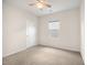 Bright, unfurnished bedroom with neutral carpet flooring and a ceiling fan at 4102 Catfish Way, Durham, NC 27703