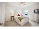 Cozy bedroom with a ceiling fan, neutral walls, and carpet flooring, creating a warm and inviting atmosphere at 4102 Catfish Way, Durham, NC 27703