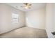 Bright, unfurnished bedroom with neutral carpet flooring and a ceiling fan at 4102 Catfish Way, Durham, NC 27703