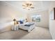 Bright bedroom features a trey ceiling, ceiling fan, carpet flooring, and natural light from a window at 4102 Catfish Way, Durham, NC 27703