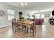 Charming dining area with wood floors and an adjacent living room, perfect for entertaining guests at 4102 Catfish Way, Durham, NC 27703