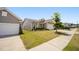 Well-maintained home with green lawn, landscaped garden bed and concrete driveway located in a quiet residential neighborhood at 4102 Catfish Way, Durham, NC 27703