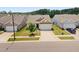 Charming single-Gathering home boasts a well-manicured lawn, inviting curb appeal, and an attached two-car garage at 4102 Catfish Way, Durham, NC 27703