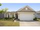 Inviting single-Gathering home with a two-car garage, well-kept lawn, and attractive landscaping that welcomes you home at 4102 Catfish Way, Durham, NC 27703