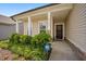 Charming front porch with classic columns and beautiful landscaping at 4102 Catfish Way, Durham, NC 27703