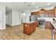 Spacious kitchen with stainless steel appliances, center island, and luxury vinyl flooring at 4102 Catfish Way, Durham, NC 27703
