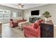 Cozy living room with comfortable seating, stylish decor, hardwood flooring, and natural lighting at 4102 Catfish Way, Durham, NC 27703