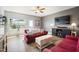 Cozy living room with a ceiling fan, comfortable seating, and a large window providing natural light at 4102 Catfish Way, Durham, NC 27703