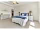 A spacious and bright main bedroom with an inviting bed, dresser, and serene decor at 4102 Catfish Way, Durham, NC 27703