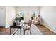 A home office is filled with natural light, wood floors and a calming decor at 4102 Catfish Way, Durham, NC 27703