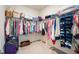 Organized walk-in closet features ample hanging space, shelves, and storage solutions, maximizing space and convenience at 4102 Catfish Way, Durham, NC 27703