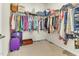 Spacious walk-in closet featuring ample shelving, hanging space, and a dedicated shoe rack at 4102 Catfish Way, Durham, NC 27703
