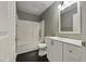 Clean bathroom with a shower and tub combination, vanity with drawers and cabinets, and a sleek mirror at 414 Longfellow St, Fuquay Varina, NC 27526