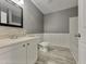 Updated bathroom with white vanity, modern fixtures, and stylish tile flooring at 414 Longfellow St, Fuquay Varina, NC 27526