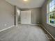 This carpeted bedroom is ready for its new residents at 414 Longfellow St, Fuquay Varina, NC 27526