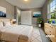 Bright bedroom featuring neutral decor, a plush rug, and a cozy bed, creating a relaxing atmosphere at 414 Longfellow St, Fuquay Varina, NC 27526
