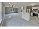 Open-concept living room with a view into the updated kitchen at 414 Longfellow St, Fuquay Varina, NC 27526