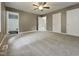 This main bedroom has an ensuite bathroom, carpet flooring, and closet at 414 Longfellow St, Fuquay Varina, NC 27526