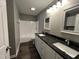 Modern bathroom features double vanity with granite countertop and tub/shower combination at 427 Elm Ct, Burlington, NC 27215