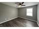 Bedroom featuring hardwood floors, a window, and a ceiling fan at 427 Elm Ct, Burlington, NC 27215