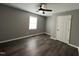 Cozy bedroom featuring a ceiling fan, updated flooring, and natural light at 427 Elm Ct, Burlington, NC 27215