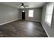 Modern living room featuring neutral paint, contemporary ceiling fan, and stylish flooring at 427 Elm Ct, Burlington, NC 27215