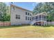Backyard with a view of the house and a wooden fence, great for relaxing and entertaining at 45 Pebble Creek Dr, Franklinton, NC 27525