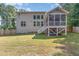 Expansive backyard featuring a well-maintained lawn, privacy fence, and a screened-in porch at 45 Pebble Creek Dr, Franklinton, NC 27525
