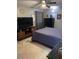 Spacious bedroom featuring a ceiling fan, large TV, and ample natural light, creating a welcoming atmosphere at 45 Pebble Creek Dr, Franklinton, NC 27525