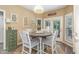Charming breakfast nook with a round table, comfortable seating, and natural light at 45 Pebble Creek Dr, Franklinton, NC 27525