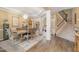 Elegant dining room with hardwood floors, a chandelier, and a view of the staircase at 45 Pebble Creek Dr, Franklinton, NC 27525