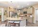 Inviting kitchen features granite countertops, a stainless steel refrigerator, and a decorative island with seating at 45 Pebble Creek Dr, Franklinton, NC 27525
