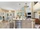 Bright kitchen with granite countertops, stainless steel appliances, and an open view to the living and dining areas at 45 Pebble Creek Dr, Franklinton, NC 27525