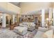 Open-concept living room connected to the kitchen featuring high ceilings, a fireplace, and stylish furnishings at 45 Pebble Creek Dr, Franklinton, NC 27525