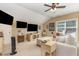 Inviting living room with multiple TVs, comfortable seating, and ample natural light at 45 Pebble Creek Dr, Franklinton, NC 27525