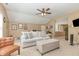 Comfortable living room featuring neutral tones, a ceiling fan, and a spacious layout at 45 Pebble Creek Dr, Franklinton, NC 27525