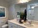 Bright bathroom with double sinks, modern fixtures, and a large mirror at 46 Atherton Circle, Angier, NC 27501