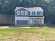 Charming two-story home with a welcoming front entrance and an attached two car carport at 46 Atherton Circle, Angier, NC 27501